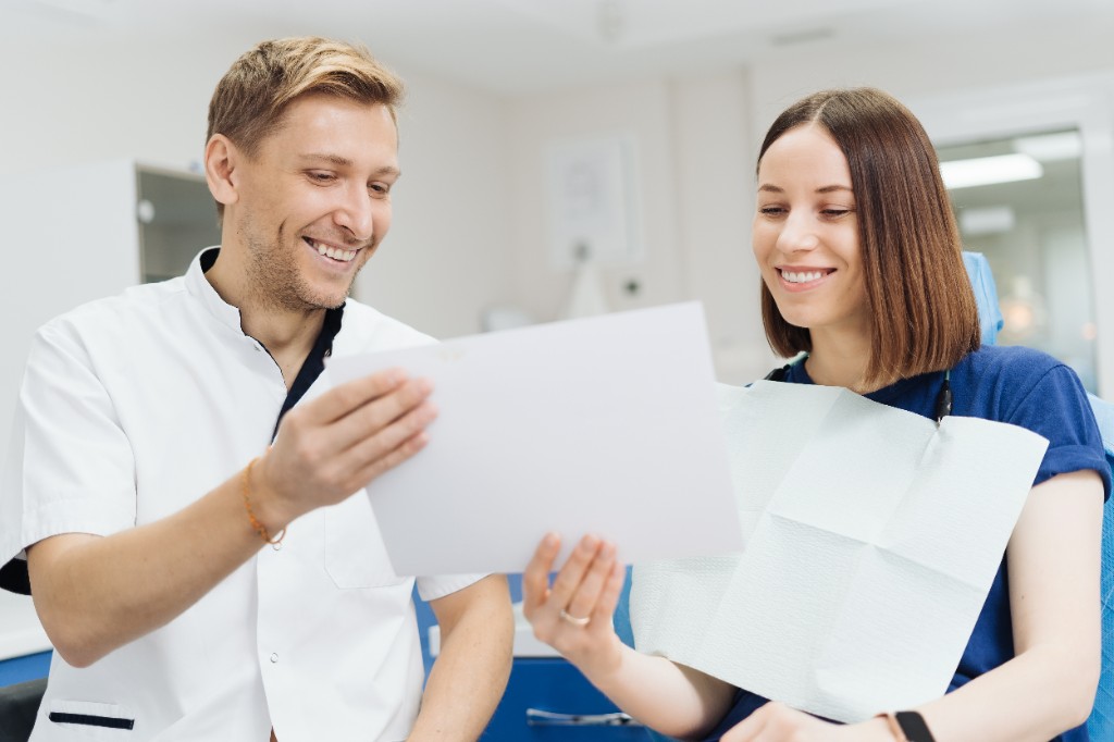 A dentist and patient reviewing the treatment plan together